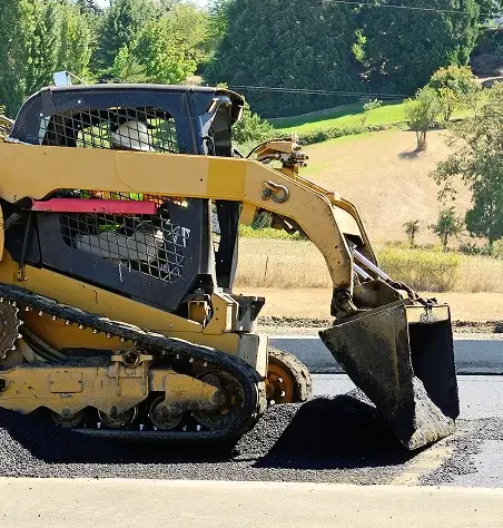 skid steer pushing material